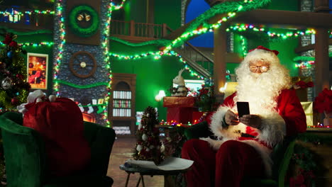 santa claus using smartphone in a festive christmas scene