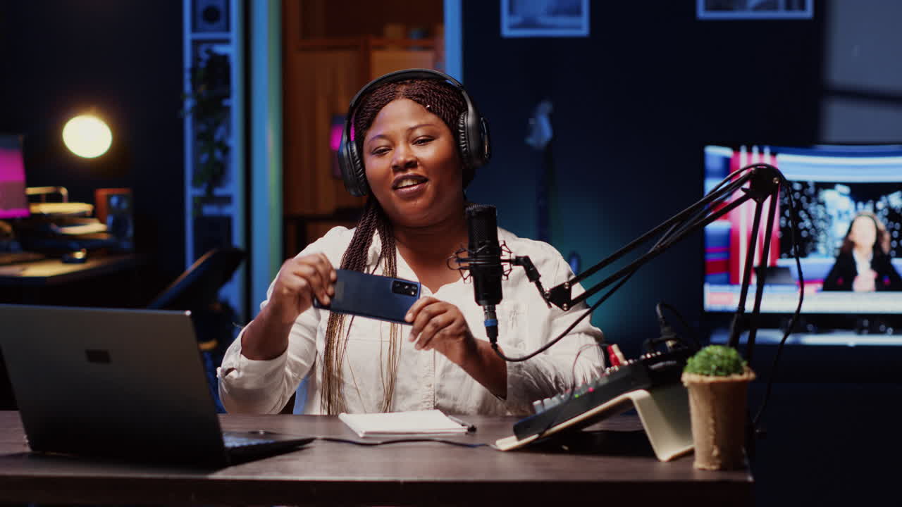 Tech content creator filming technology review of newly launched smartphone