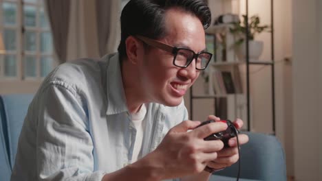 disappointed gamer playing a game, face gesture when he lost the game at home