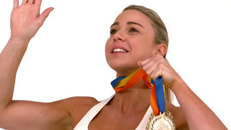 happy female athlete holding medals