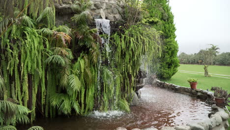 static shot of a cascading waterfall feature in a garden in pachacamac, lima, peru