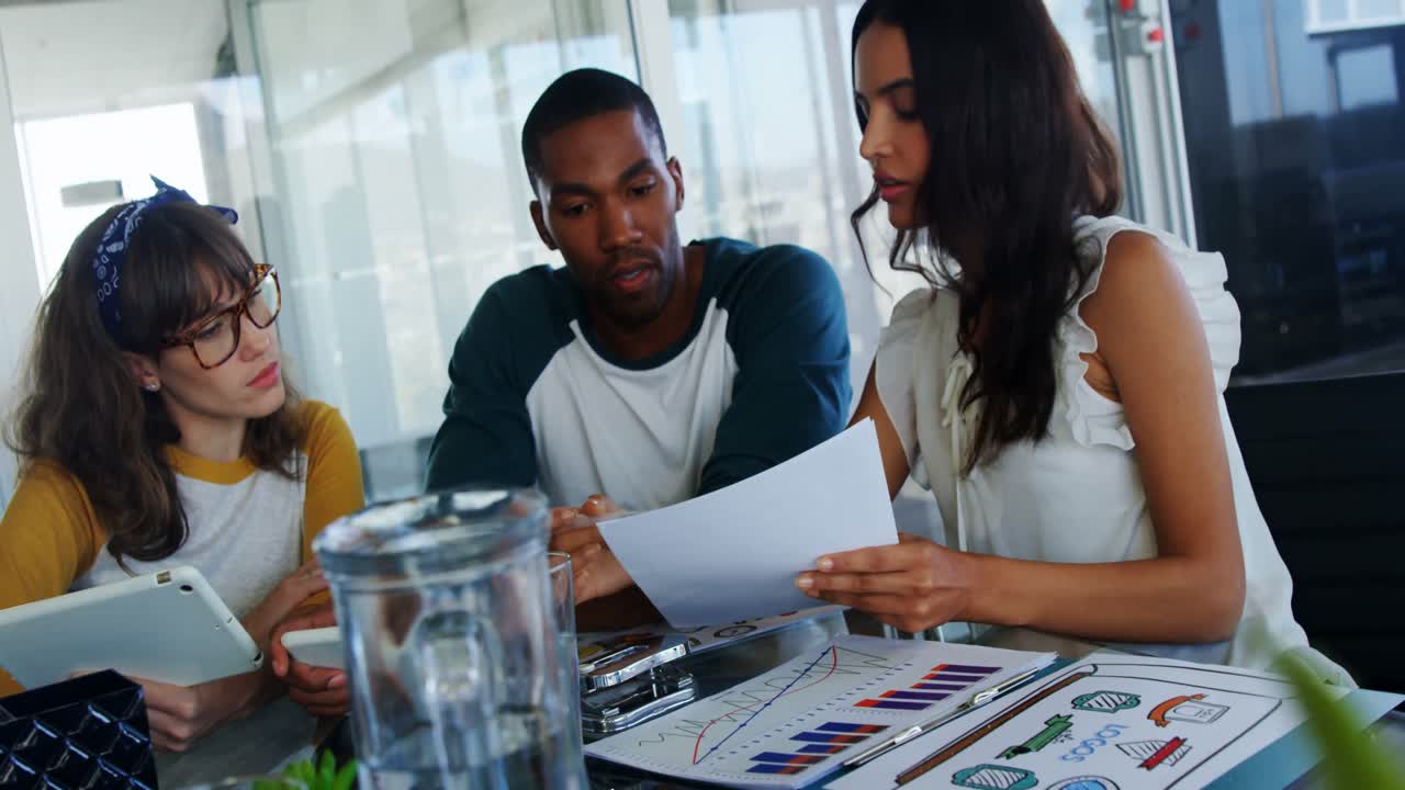 Executives having discussion over document