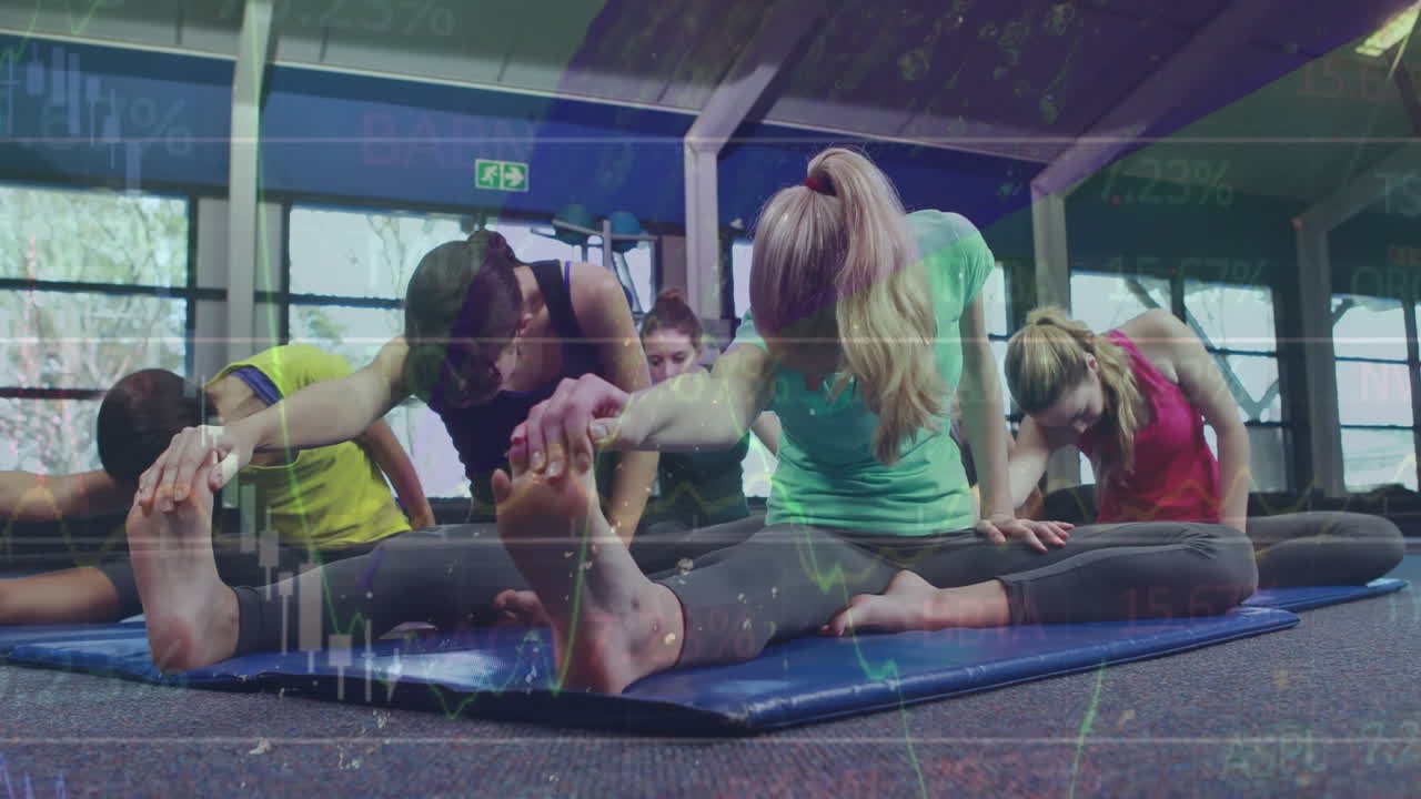 Fitness class stretching hamstrings on blue mats, overlaying animated health charts and ball icons