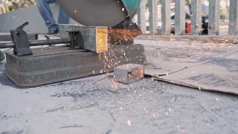 cut-off machine cutting metal tubular with sparks