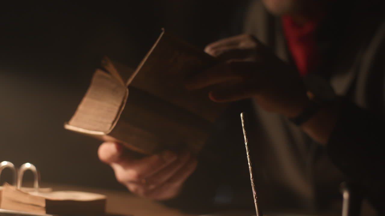 Old passionate man read a book in his office at night