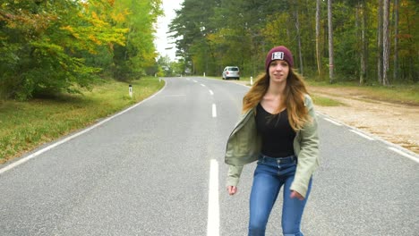 Happy-Young-girl-with-red-hair-in-inline-skates-and-jump-on-the-street