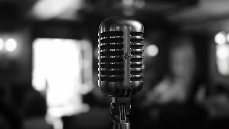 a classic microphone ready to capture the rhythms and melodies of a performance in a cozy atmosphere, echoing the vibes of live music and entertainment