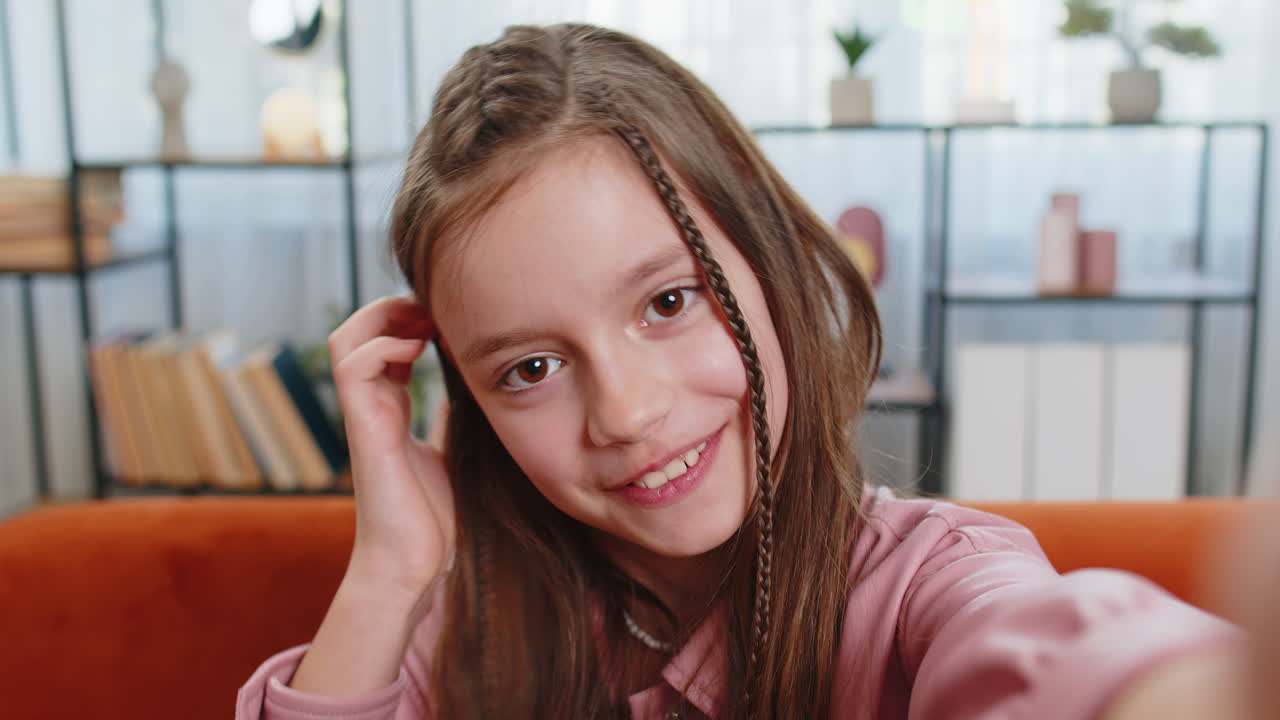 Pov of girl blogger taking selfie on smartphone video call online recording vlog stories at home
