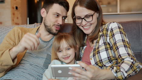 Family Watching a Mobile Phone Together