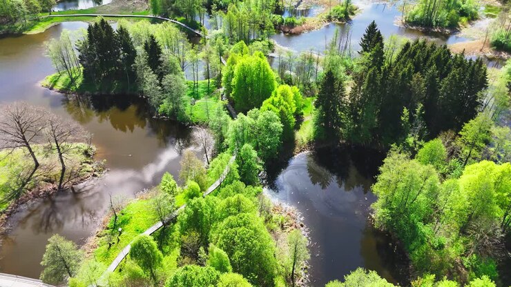 Biržai Regional Park, Lithuania - A Breathtaking View Showcases Winding Walkways, Serene Karst Lakes, and Richly Wooded Landscapes - Aerial Drone Shot