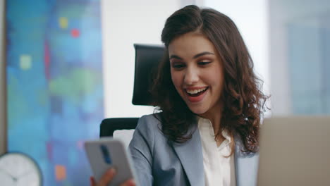 smiling woman start telephone conversation sitting office close up. girl call