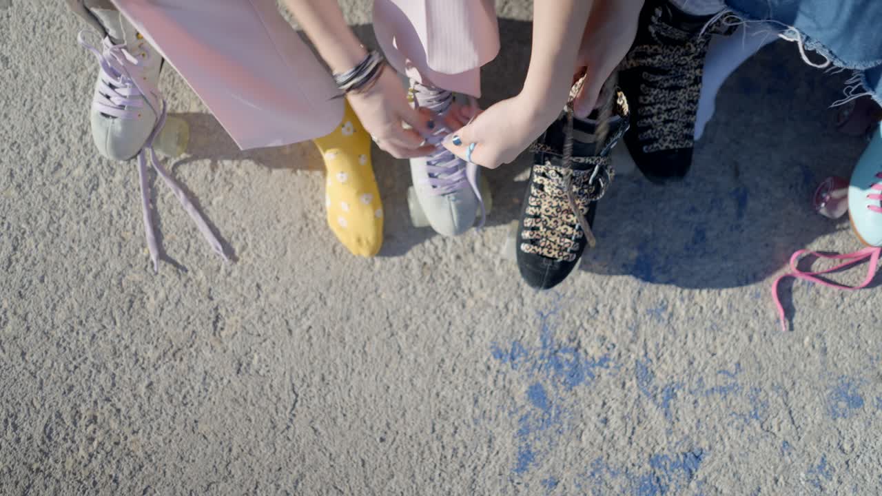Friends Lacing Up Roller Skates