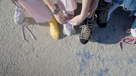 friends lacing up roller skates