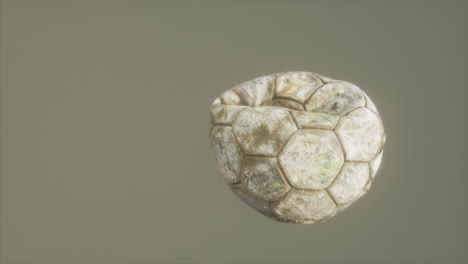 old deflated leather soccer ball