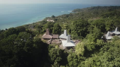 aerial footage of traditional indonesian style house in remote village in east nusa tenggara indonesia near sumba beach