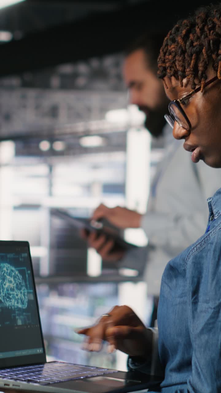 Vertical video System administrators in data center monitoring AI LLM visualization