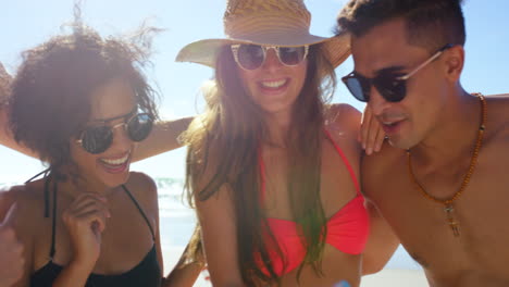 group of friends taking a selfie on the beach