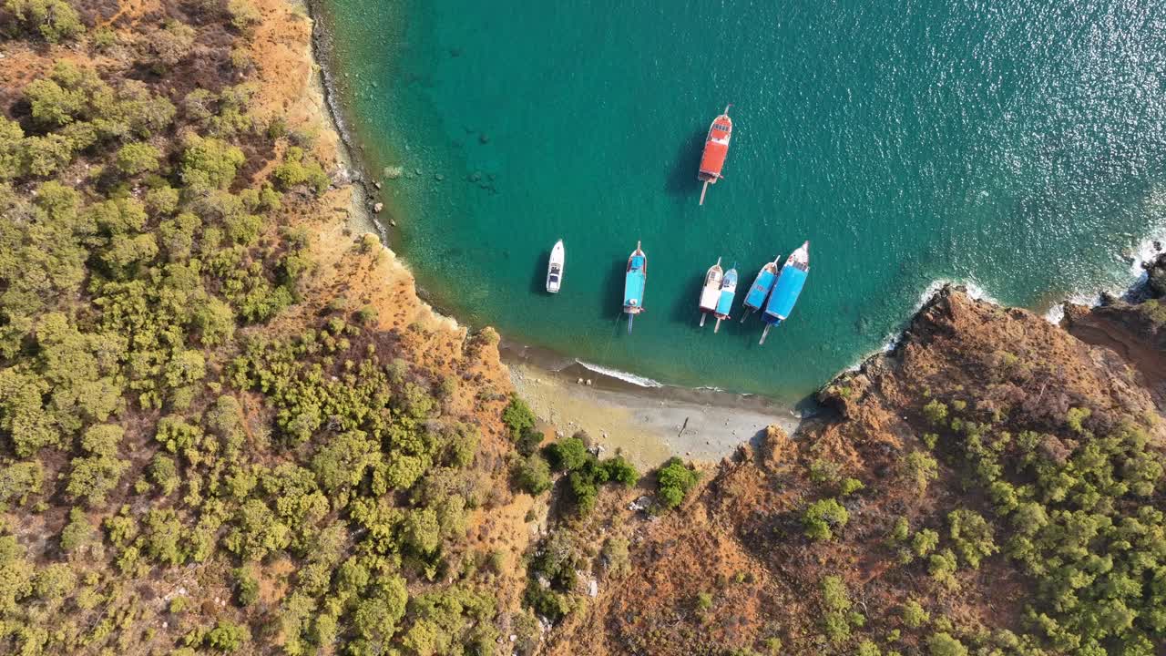 Aerial View of Boats in a Turquoise Bay