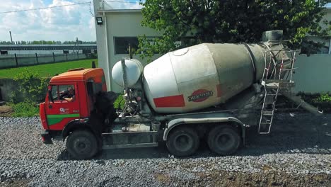 concrete mixer truck from air. heavy industrial machinery working at construction site