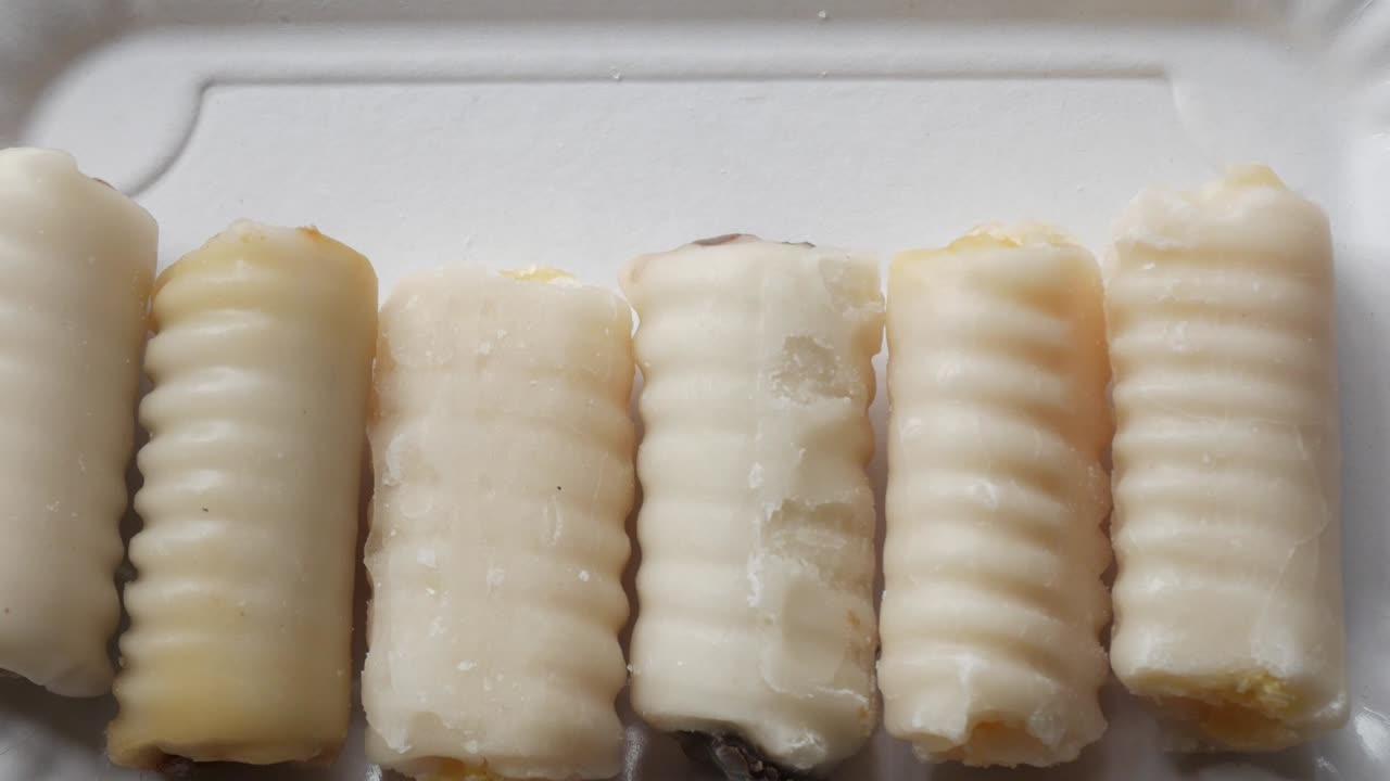 Traditional spanish sweet made with a marzipan on All Saints Day. Huesos de Santo (Saint's Bones)