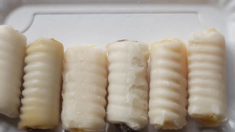 traditional spanish sweet made with a marzipan on all saints day. huesos de santo (saint's bones)