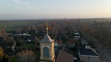 jib down of golden crucifix on top of church tower