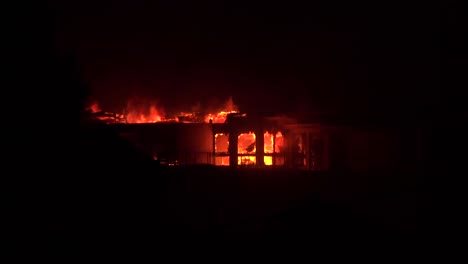 a large home burns at night during the 2017 thomas fire in ventura county california