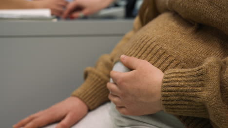 woman touching her belly