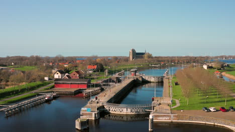 Aerial:-The-locks-of-the-Canal-through-Walcheren,-near-the-historical-town-Veere