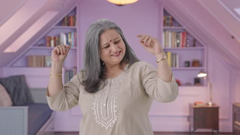 Happy-Indian-old-woman-dancing-and-enjoying