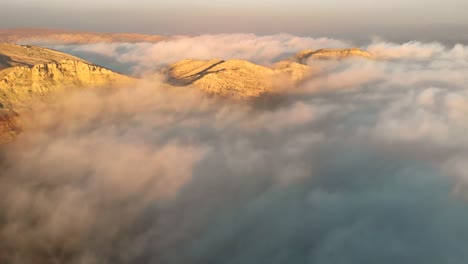 aerial drone footage capturing cloud formations at sunset, revealing nature's tranquil beauty from above