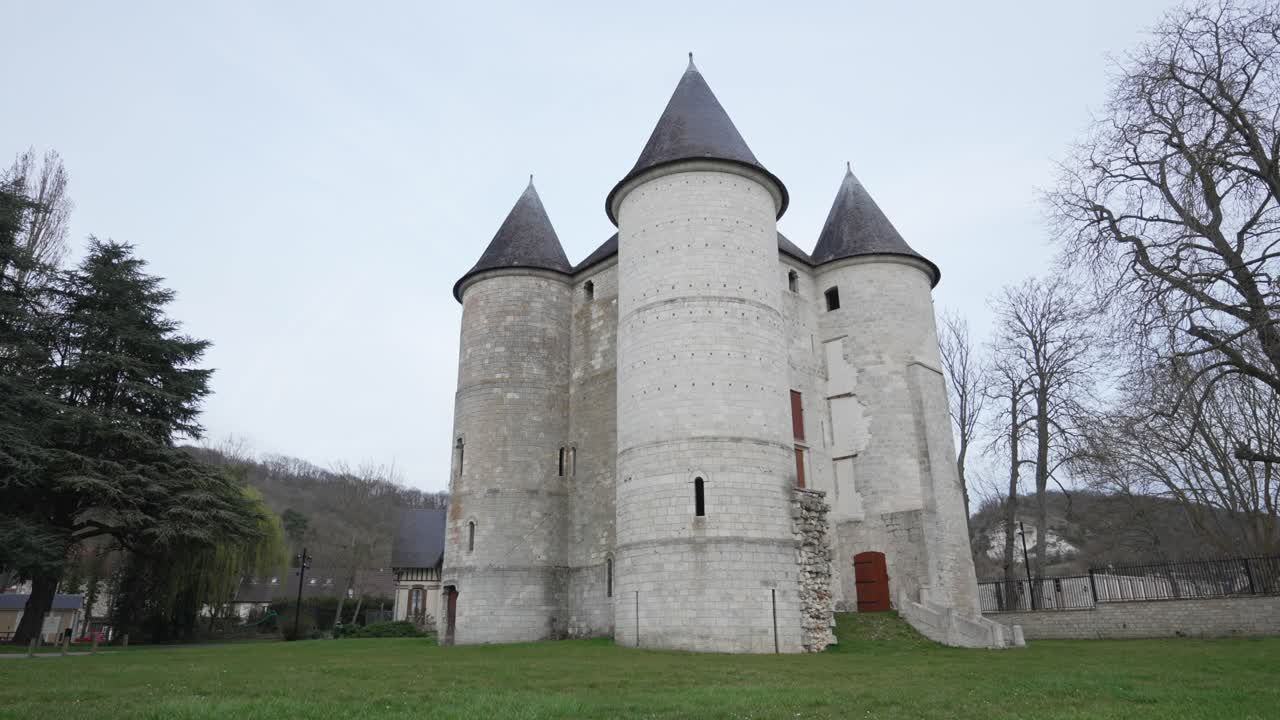 Pan up to reveal entire white castle and black rounded tower tops