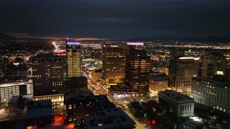 impressive aerial view of downtown salt lake city utah at night - forward movement