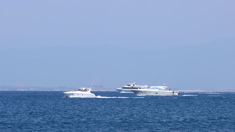 two boats moving across the sea