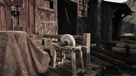 old grindstone in rustic barn