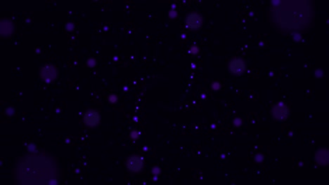 partículas de bokeh púrpura sobre un fondo negro
