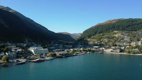 Aerial-establishing-view-of-Queenstown,-New-Zealand-on-coast-of-Queenstown-Bay