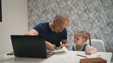 young-bald-bearded-dad-cuts-out-figurine