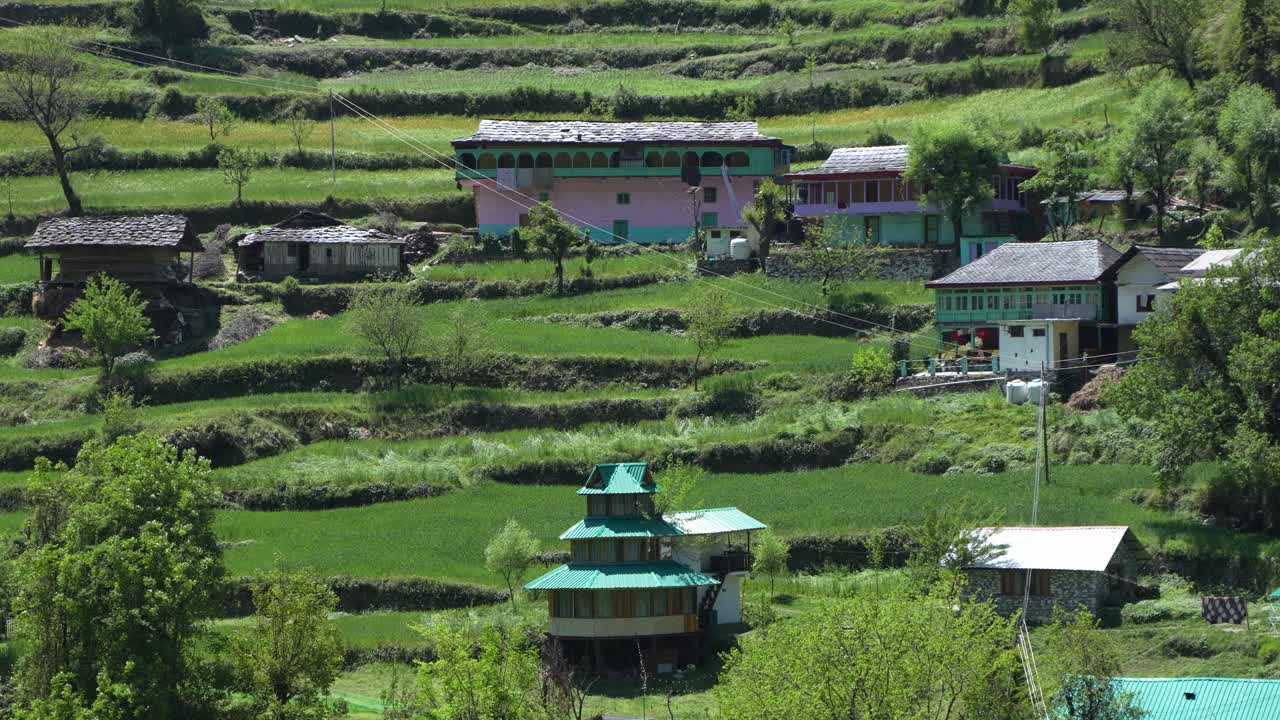 Farming and houses on the slopes of the mountains.