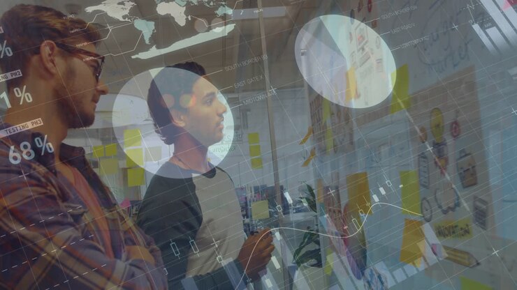 Animation of graphs and data over diverse male coworkers brainstorming in office