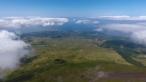 Flying-high-bove-the-clouds-on-the-island-of-Pico-in-the-Azores,-Portugal