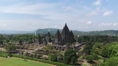 wide angle cinematic establishing aerial drone view of prambanan temple, sunny day, yogyakarta, indonesia