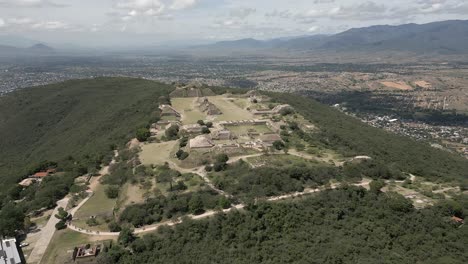sunny day aerial to monte alban zapotec temple ruins in oaxaca, mexico