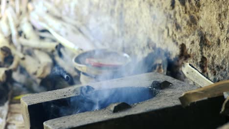 an open cooking fire, typical for rural asia kitchen