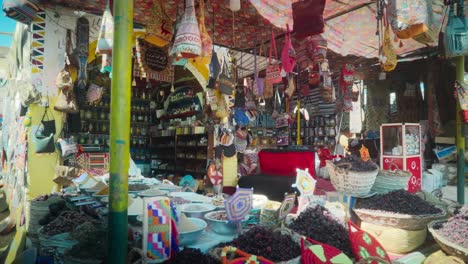 traditional egyptian spice and tea shop in a bazaar, luxor egypt. 
slow rotational movement.