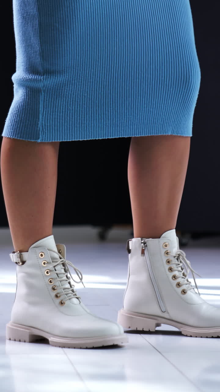 Gorgeous lady legs with fashionable shoes. Slow motion with elegant legs and footwear. Vertical video