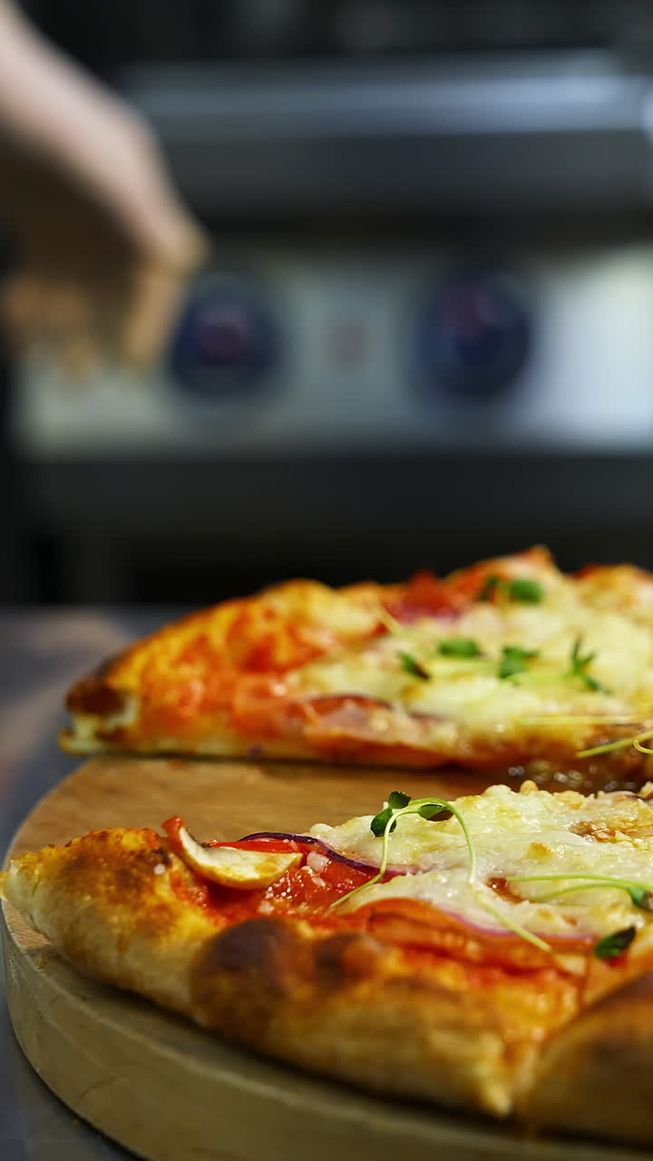 Hand taking pizza slice. Hot tasty pizza ready to eat. Pizza on a wooden board. Delicious pizza with fresh green sprouts. Close-up. Vertical video