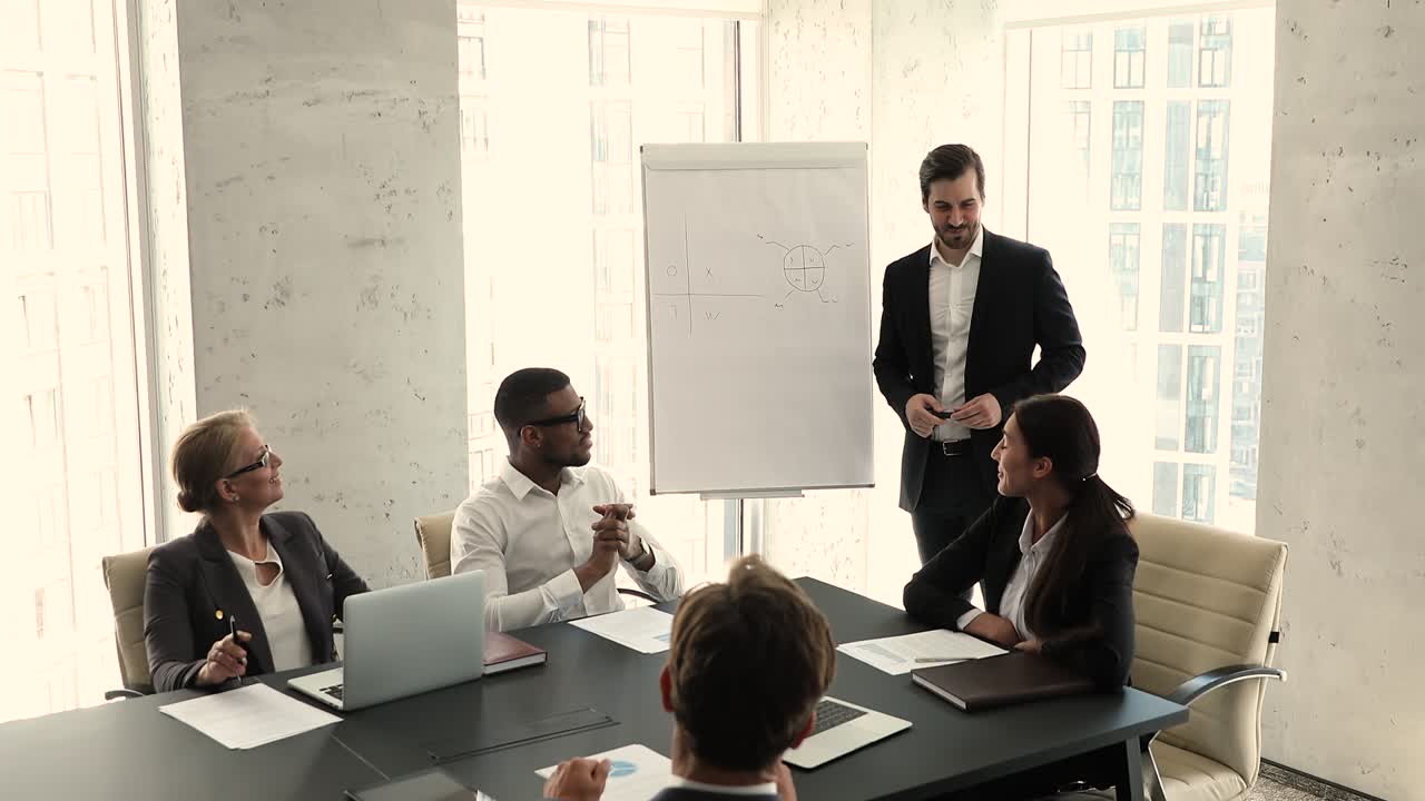 Boss holds briefing with multi ethnic company employees