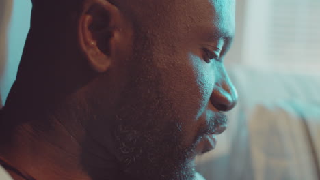 close up of african american man reading aloud