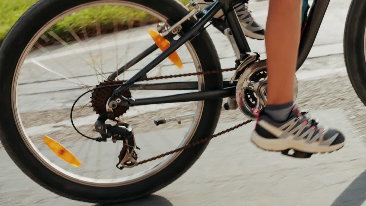 Man ride bicycle near beach in Barcelona, city morning, carbon neutral transportation. Travel, sustainability and cycling with male speed and transit,